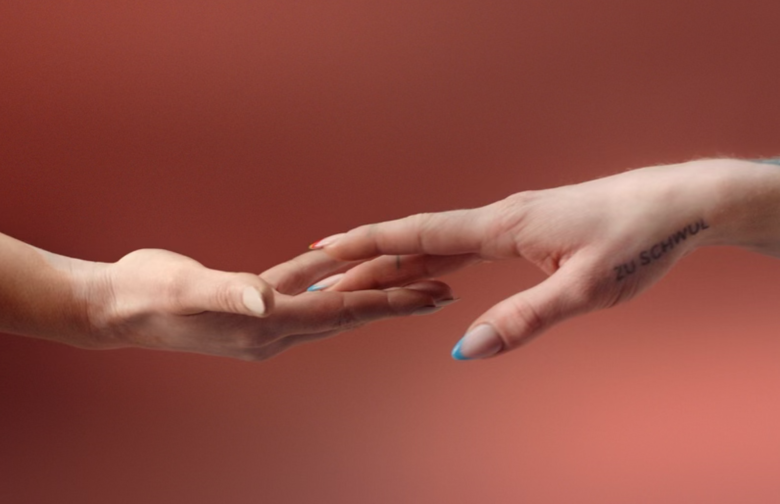 Two hands touching each other, a screenshot of the commercial.
